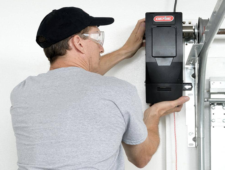 Close-up of professional technician servicing a genie garage door